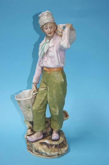 A Royal Dux figure of a boy holding two baskets, p