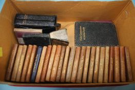 A collection of various mini leather bound books