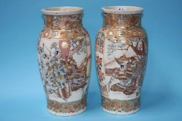 A pair of Japanese Satsuma vases decorated with pa