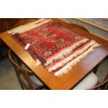 A teak dining table and four chairs