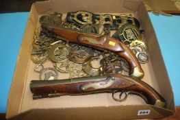 Horse brasses and reproduction flintlock pistols
