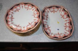 Twelve Royal Crown Derby dinner plates and a serving plate