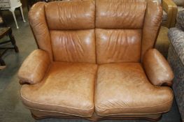 Tan leather two seatter sette
