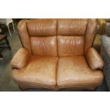 Tan leather two seatter sette