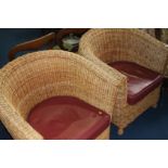 Pair of wicker chairs with leather seat pads