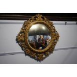 Circular gilt framed mirror