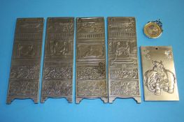 Five white metal Oriental tokens