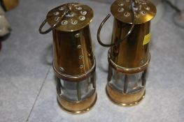 Two mini brass miners lamps