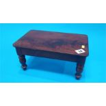 A miniature Victorian mahogany dining table. 31cm long 19cm wide