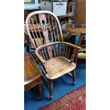 A stick back Windsor armchair.