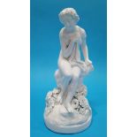 A Continental figure of a Classical lady seated on a rock. 27cm high