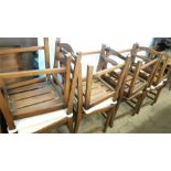 A set of eight ladderback dining chairs.