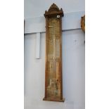 A carved oak Admiral Fitzroy's barometer. 110cm long