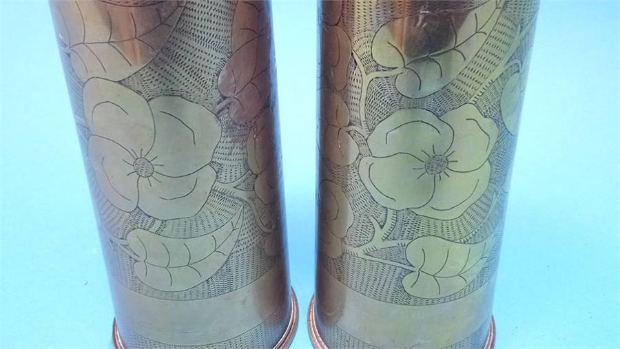 A pair of floral engraved brass shell cases. - Image 2 of 2