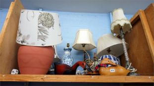 Shelf of lamps.