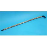 A bone vertebrae walking cane. 93cm long