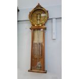 A Victorian carved oak Royal Polytechnic barometer by Joseph Davis and Company, London. 105cm long