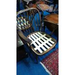 A pair of Ercol armchairs.