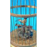 A Reuge Music Saint Croix clockwork automaton of two birds in a birdcage. 28cm high