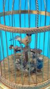 A Reuge Music Saint Croix clockwork automaton of two birds in a birdcage. 28cm high