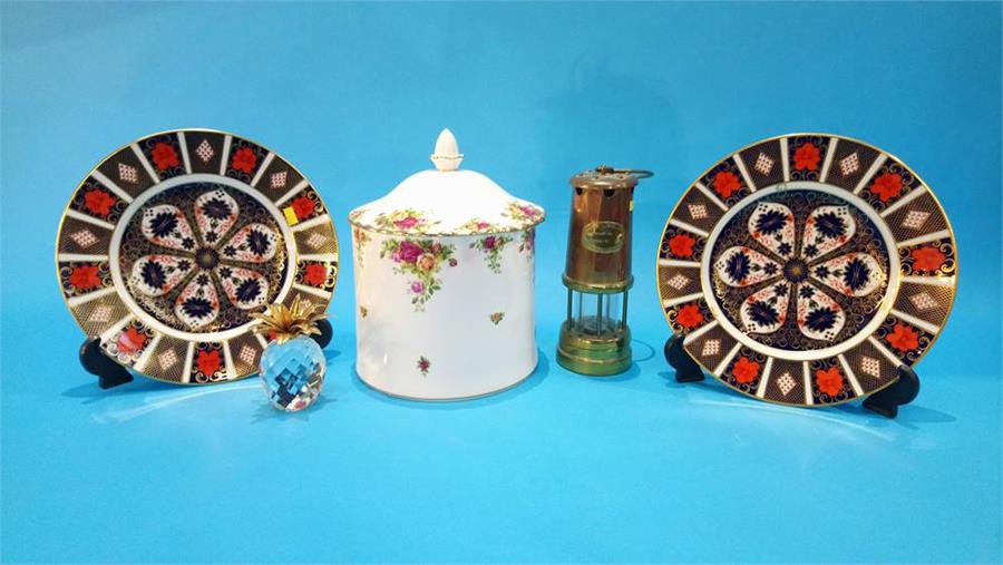 A Swarovski pineapple, a Miners lamp, two Royal Crown Derby plates etc.