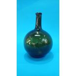 An 18th century green glass bulbous shaped wine bottle. 27 cm high