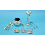 A silver spill vase, an 800 standard silver bowl, silver wine labels, sugar tongs and five silver
