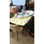 A 1950's melamine table and matching pair of chairs.