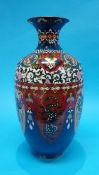 A large Japanese Cloisonné vase, decorated with panels of birds and dragons on a blue ground. 46cm