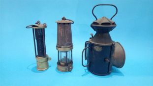 An NER lamp and two Miner's lamps.