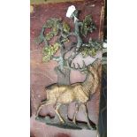 A cast lead relief plaque of a deer.