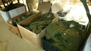 Four boxes of army uniforms.