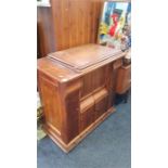 A walnut cased Singer sewing machine.