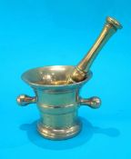 A brass pestle and mortar.