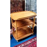 An Ercol Golden Dawn tea trolley.