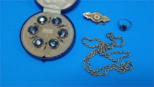 A Victorian 15ct gold brooch, a 9ct gold ring and a 9ct gold necklace, weight 7.4grams and a case of