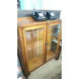 An oak glazed bookcase.