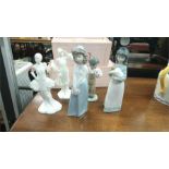 A pair of Royal Doulton figures and three Nao figures.