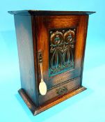An oak Smoker's cabinet with Art Nouveau panel to the front.