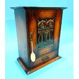 An oak Smoker's cabinet with Art Nouveau panel to the front.