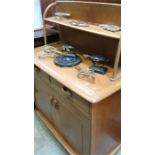 A small Ercol style light oak dresser. 91cm