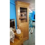 A pine corner cabinet. 223cm tall