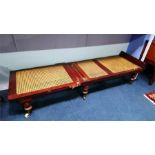A Victorian Campaign style bergere folding bed, with turned legs.