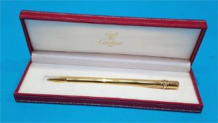 A boxed Must de Cartier pen.