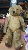 A large sixty year old plush Teddy Bear.