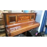 A mahogany overstrung piano.