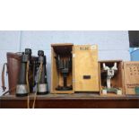 A pair of Barr and Stroud 7 X CF25 binoculars, with case and two microscopes.