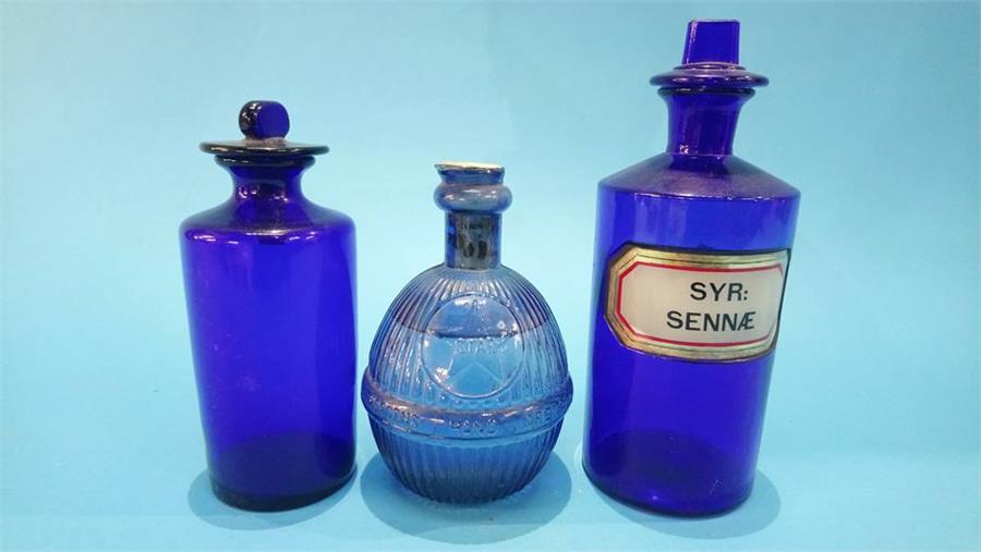 A Hardens 'Star' hand grenade and two blue glass Chemist bottles.