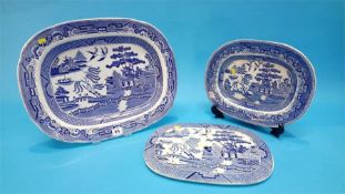 Four blue and white meat plates and a strainer dish.