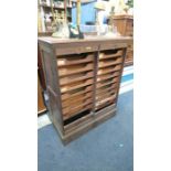 An oak tambour fronted filing cabinet. 90cm